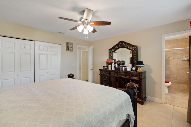 bedroom with ceiling fan, a closet, ensuite bath, and light tile patterned floors