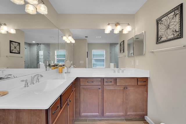 bathroom with tile patterned floors and dual bowl vanity