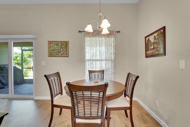 dining room featuring light hardwood / wood-style floors and an inviting chandelier