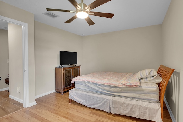 bedroom featuring ceiling fan and light hardwood / wood-style flooring