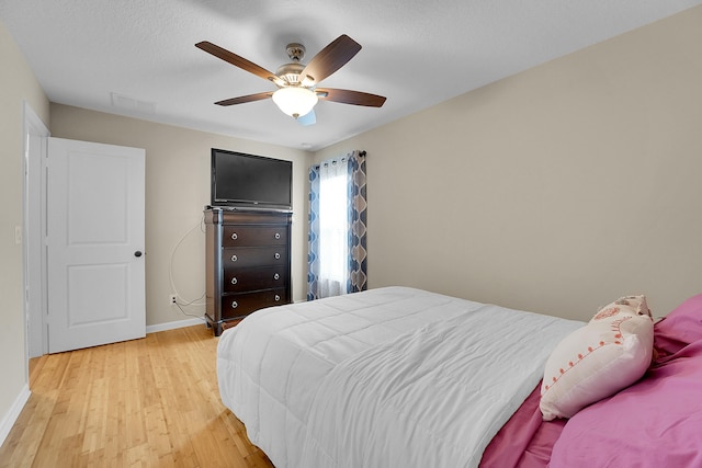 bedroom featuring ceiling fan and light wood-type flooring