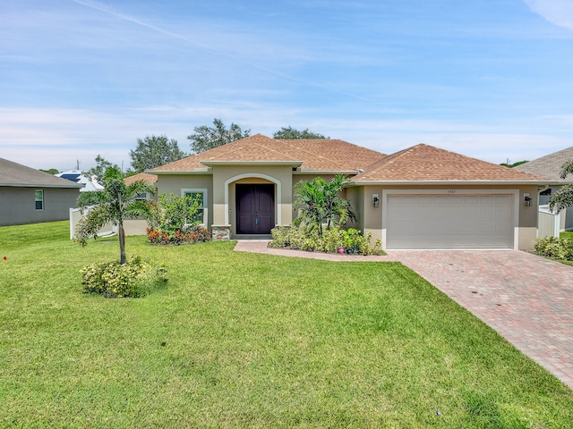 view of front of house with a front lawn and a garage