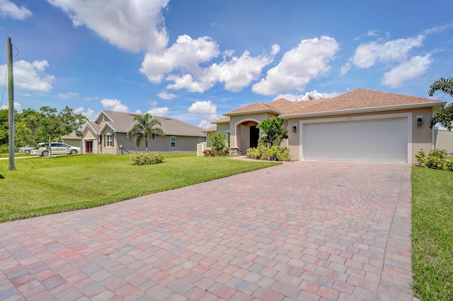 view of front of home with a garage and a front yard