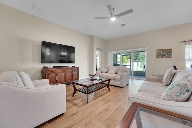 living room featuring ceiling fan and light hardwood / wood-style floors