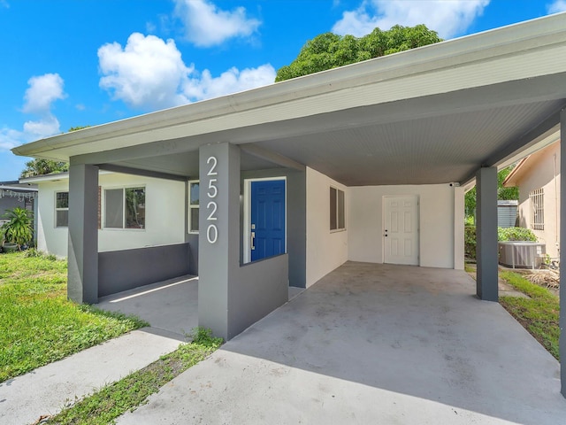 view of vehicle parking with a carport