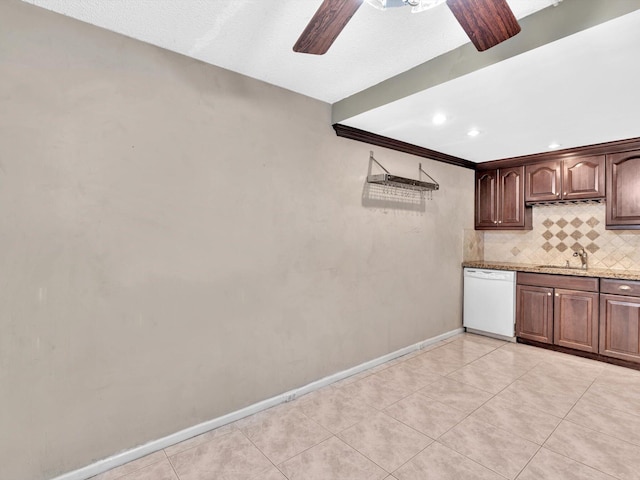 kitchen with ceiling fan, decorative backsplash, white dishwasher, light tile patterned floors, and sink