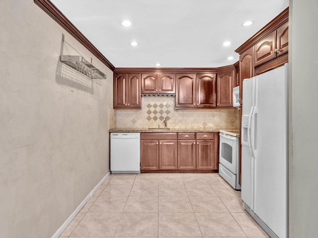 kitchen featuring backsplash, light stone countertops, light tile patterned floors, sink, and white appliances