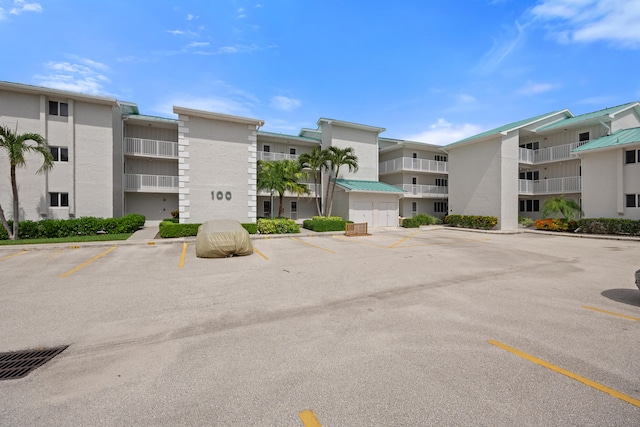 2400 S Ocean Dr Unit 124, Fort Pierce, FL 34949 - view of building exterior featuring uncovered parking