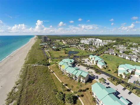 2400 S Ocean Dr Unit 124, Fort Pierce, FL 34949 - drone / aerial view featuring a view of the beach and a water view