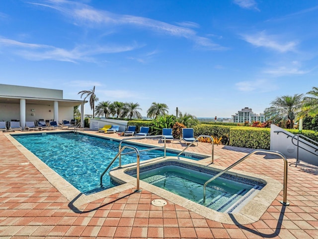 pool featuring a patio area and a hot tub