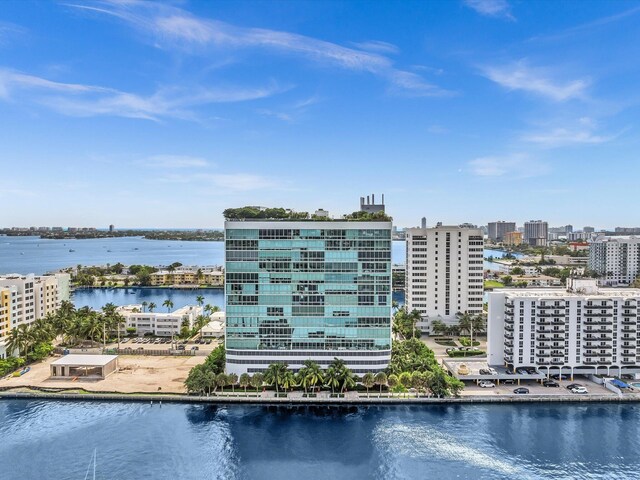 aerial view featuring a water view and a view of city