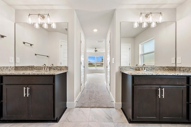 bathroom featuring ceiling fan and vanity