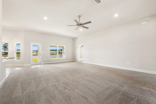 carpeted spare room with ceiling fan