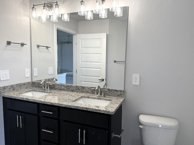 bathroom with vanity and toilet