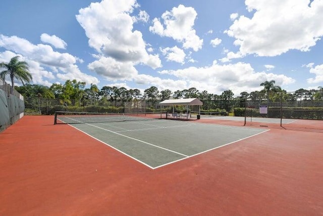 view of sport court with fence