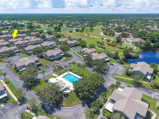 drone / aerial view with a water view and a residential view