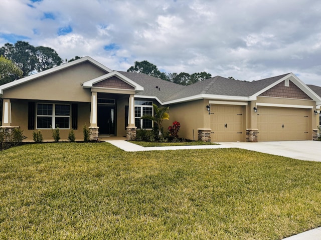 craftsman inspired home with a front lawn, an attached garage, and stucco siding