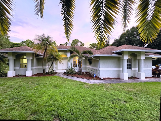 view of front of house with a lawn