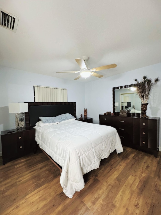 bedroom featuring ceiling fan and wood-type flooring