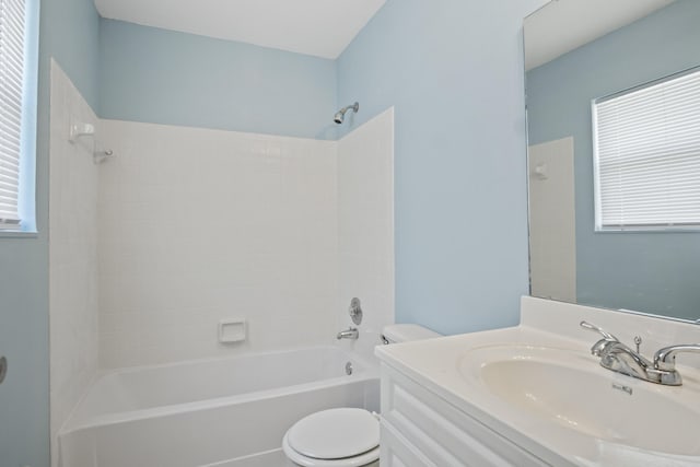 full bathroom featuring plenty of natural light, toilet, washtub / shower combination, and vanity