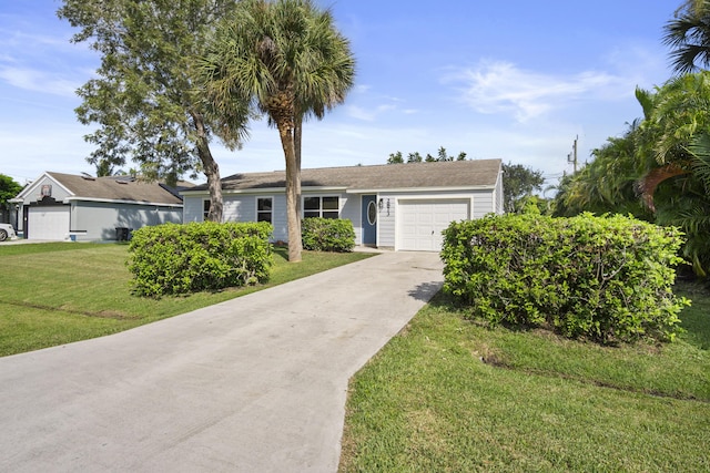 ranch-style home with a garage and a front yard