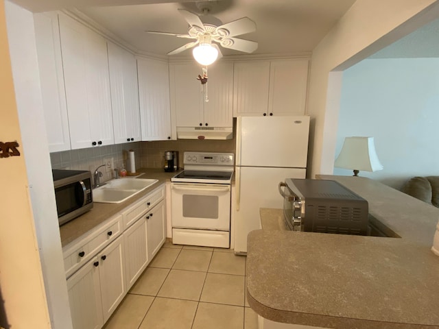 kitchen with sink, decorative backsplash, white appliances, ceiling fan, and white cabinets