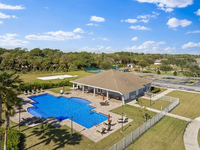 view of pool featuring a patio and a lawn