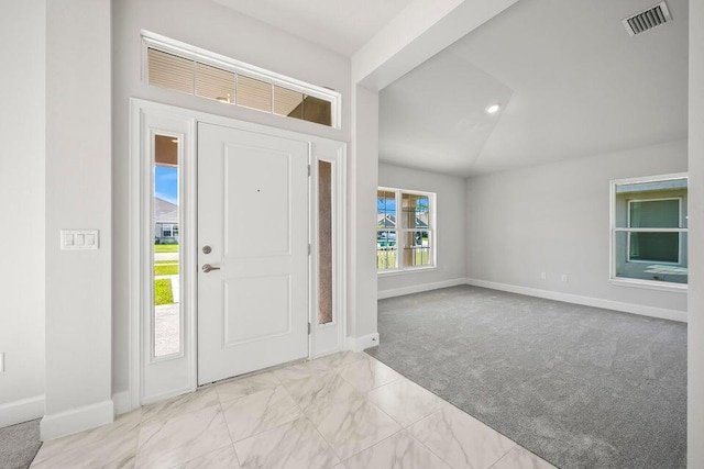 view of carpeted entrance foyer