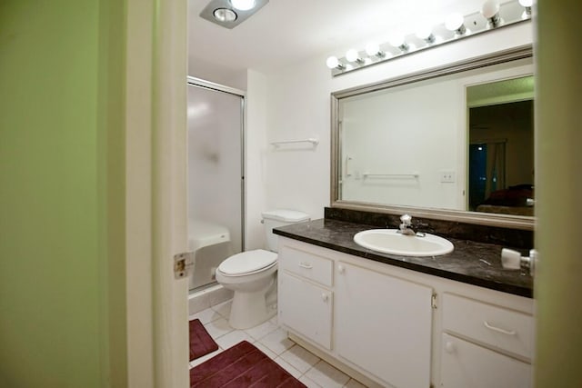 bathroom with tile patterned floors, toilet, and vanity