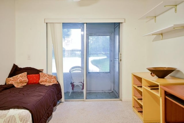 carpeted bedroom featuring access to outside