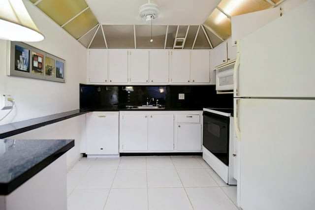 kitchen featuring decorative backsplash, white cabinetry, light tile patterned floors, sink, and white appliances