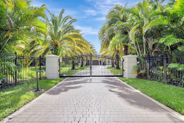 view of gate featuring a lawn