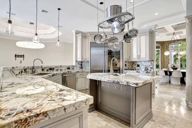 kitchen with stainless steel appliances, pendant lighting, light tile patterned floors, and tasteful backsplash