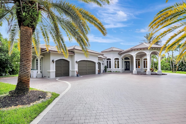 mediterranean / spanish-style home featuring a garage