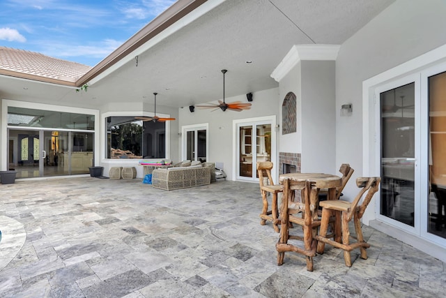 view of patio with ceiling fan and french doors