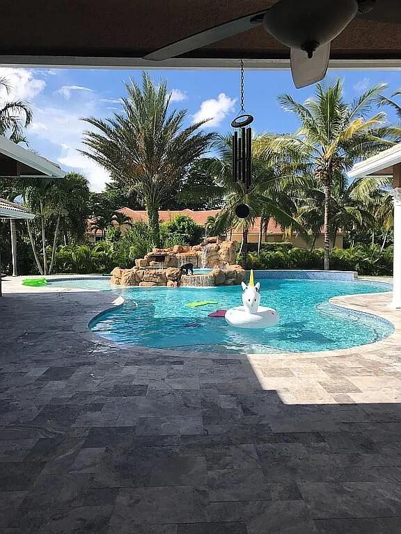 view of swimming pool with a patio area