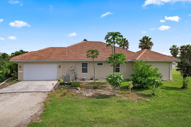 view of front facade with central AC unit, a garage, and a front lawn