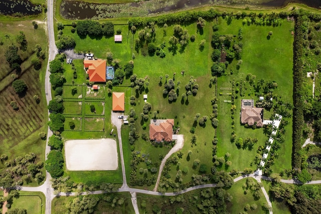 birds eye view of property with a rural view