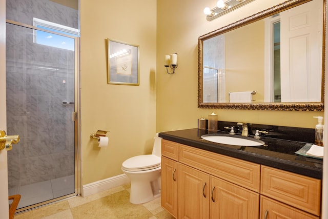 bathroom featuring tile patterned floors, a shower with shower door, vanity, and toilet