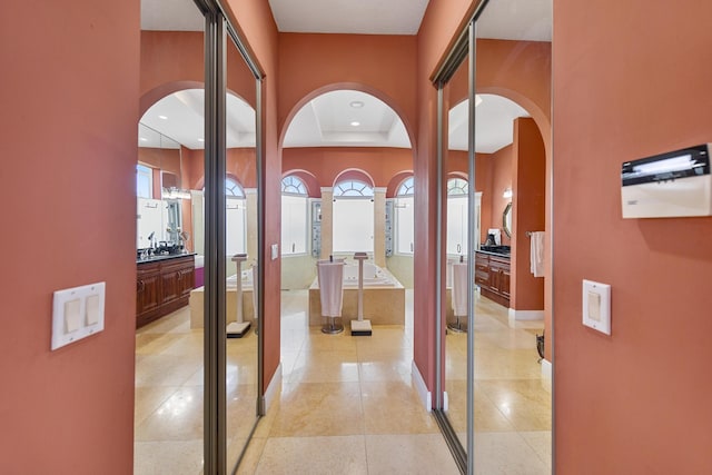 corridor featuring light tile patterned floors