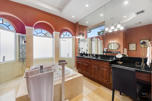 bathroom featuring tile patterned floors, vanity, and separate shower and tub