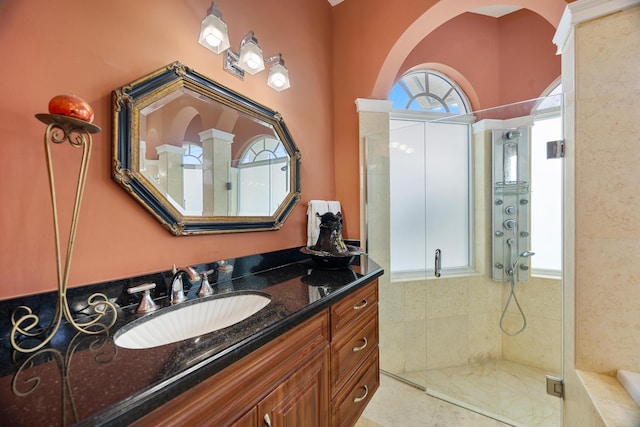 bathroom with vanity, an enclosed shower, and tile patterned floors