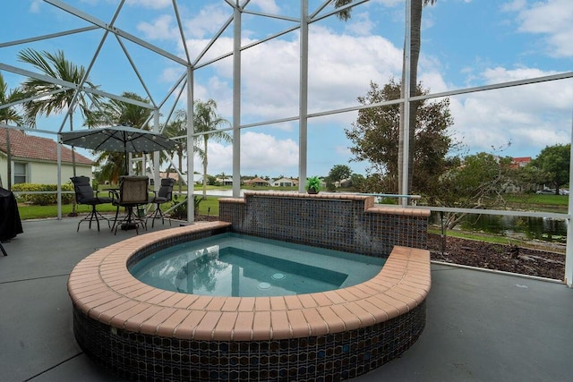 view of swimming pool featuring a patio area, a lanai, and an outdoor hot tub