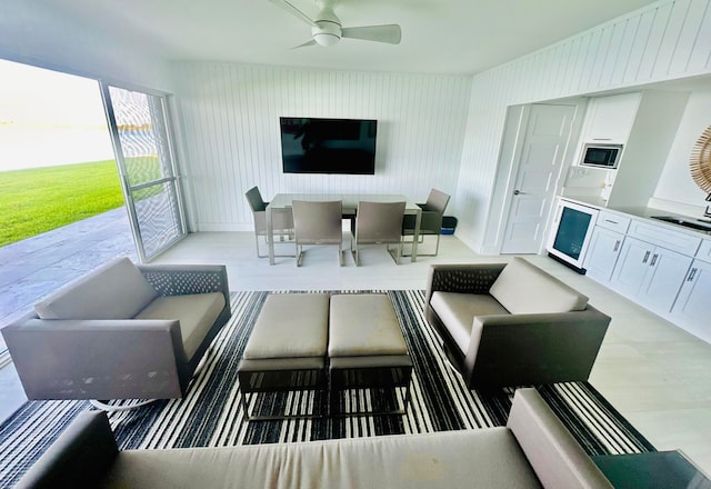 living room featuring sink and ceiling fan