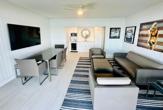 living room with wine cooler and ceiling fan