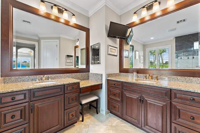 bathroom with a shower, vanity, and crown molding