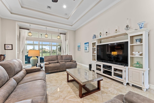 tiled living room featuring ornamental molding, a high ceiling, and a raised ceiling