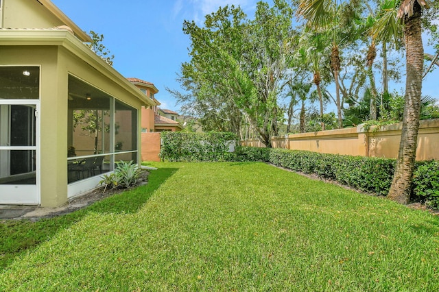 view of yard with a sunroom