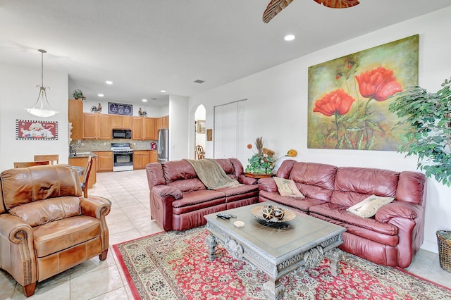 living room with sink and light tile patterned floors