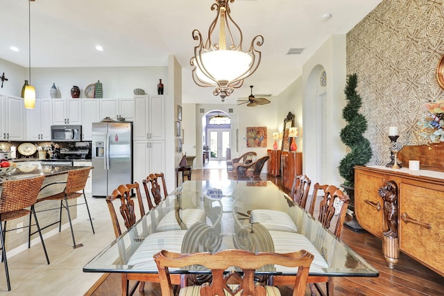 dining space featuring ceiling fan and light hardwood / wood-style floors